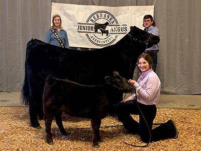 Cow/Calf Pair Champion being shown by Chase Cotton of York, NE